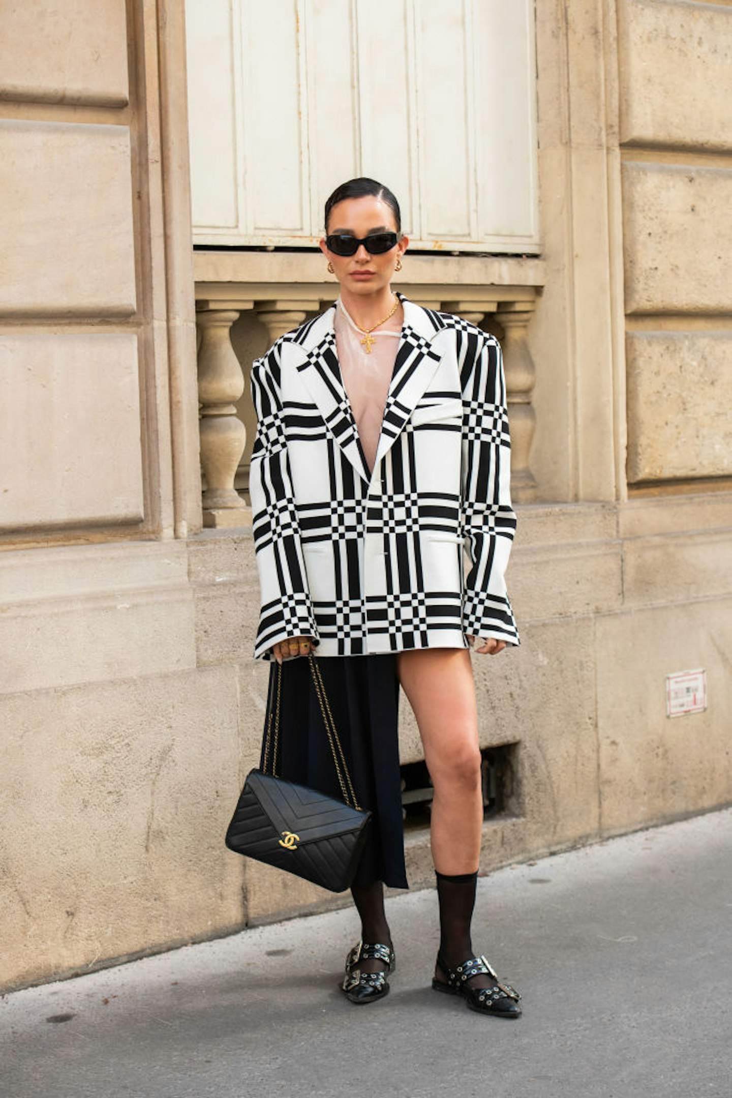 PARIS, FRANCE - SEPTEMBER 27: Alicia Roddy wears a Marni jacket, top and skirt, Ganni shoes, Chanel bag, Louis Vuitton earrings and black sunglasses during the Womenswear Spring/Summer 2024 as part of Paris Fashion Week on September 27, 2023 in Paris, France. (Photo by Kirstin Sinclair/Getty Images)