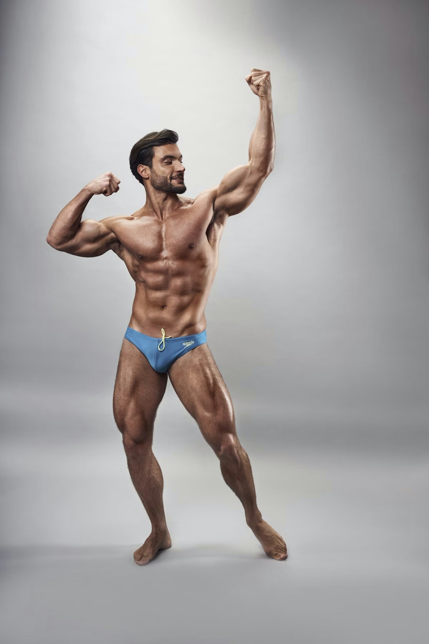 Davide poses in tiny blue panst