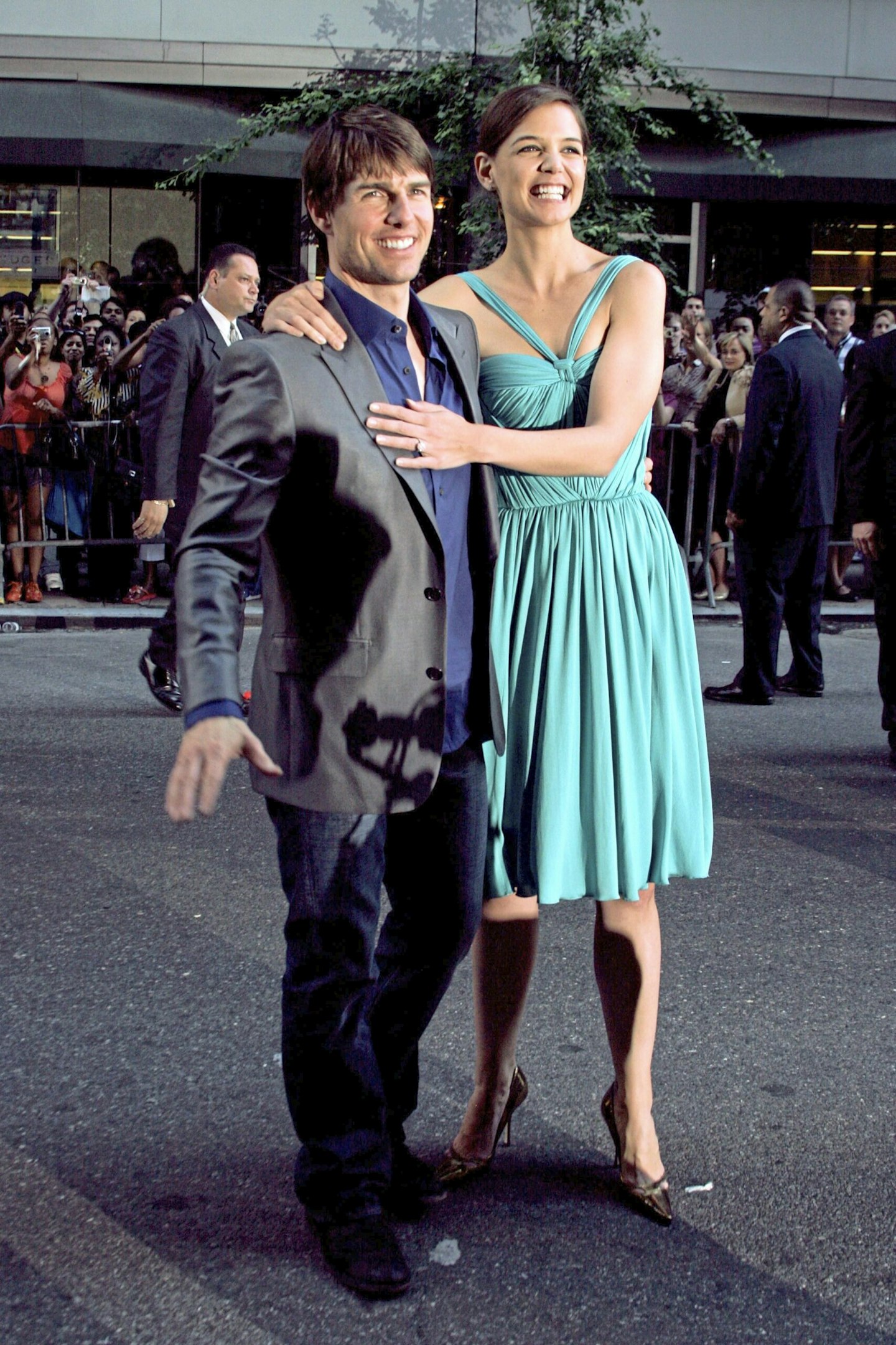 katie holmes and tom cruise smiling on the red carpet together