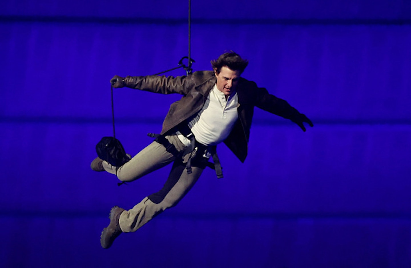 Tom Cruise leaping in air