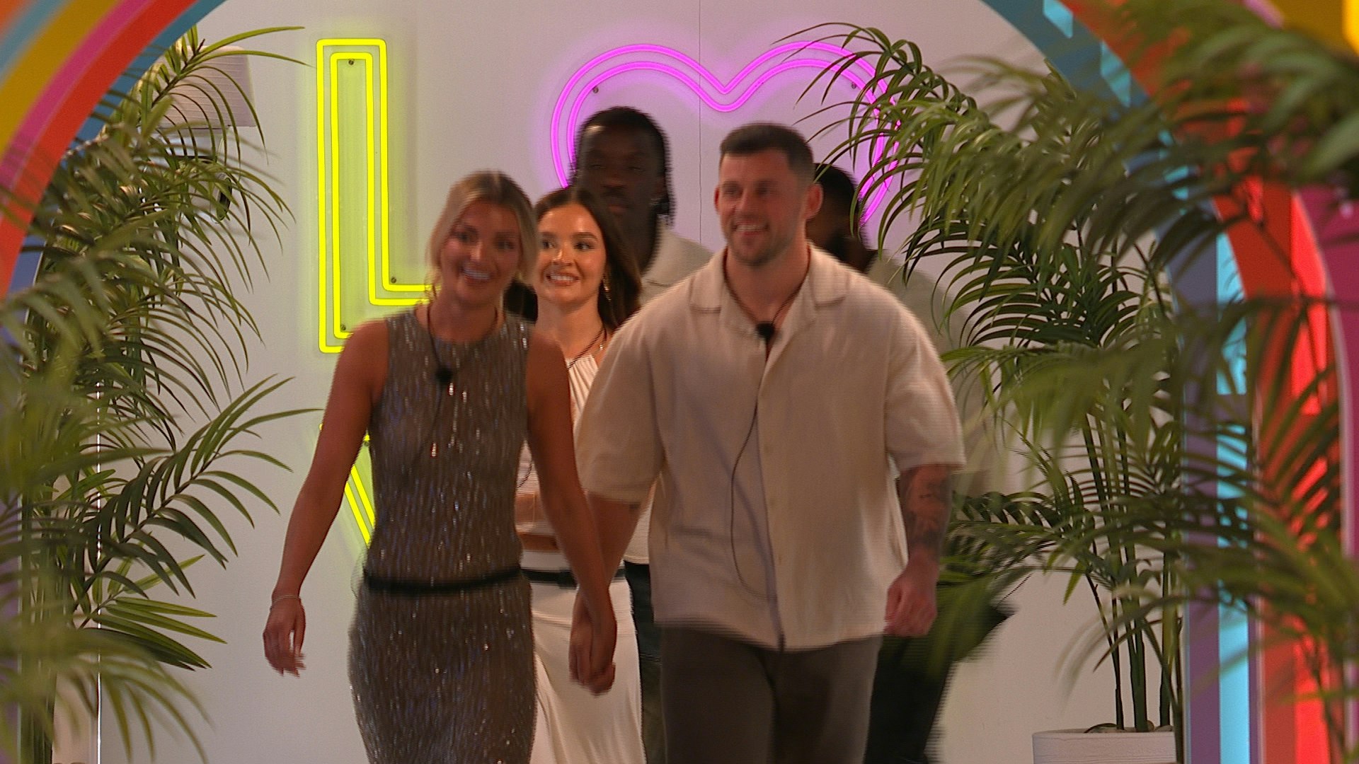Giorgio Russo and Helena Ford walking into the villa