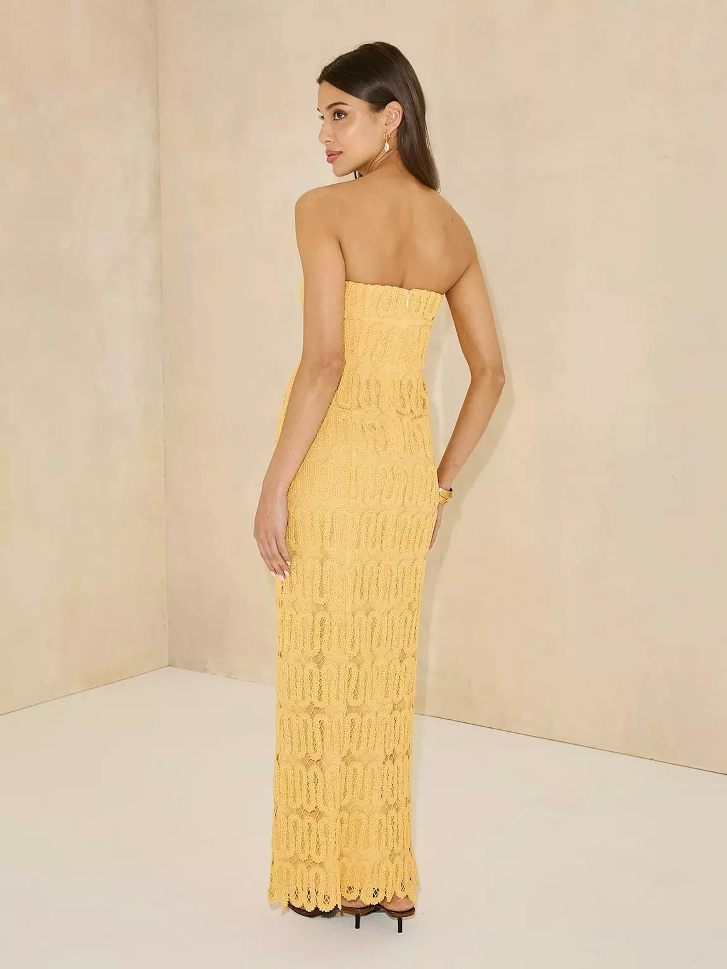 Model wearing a yellow crochet bandeau midaxi dress from Michelle Keegan's Very collection