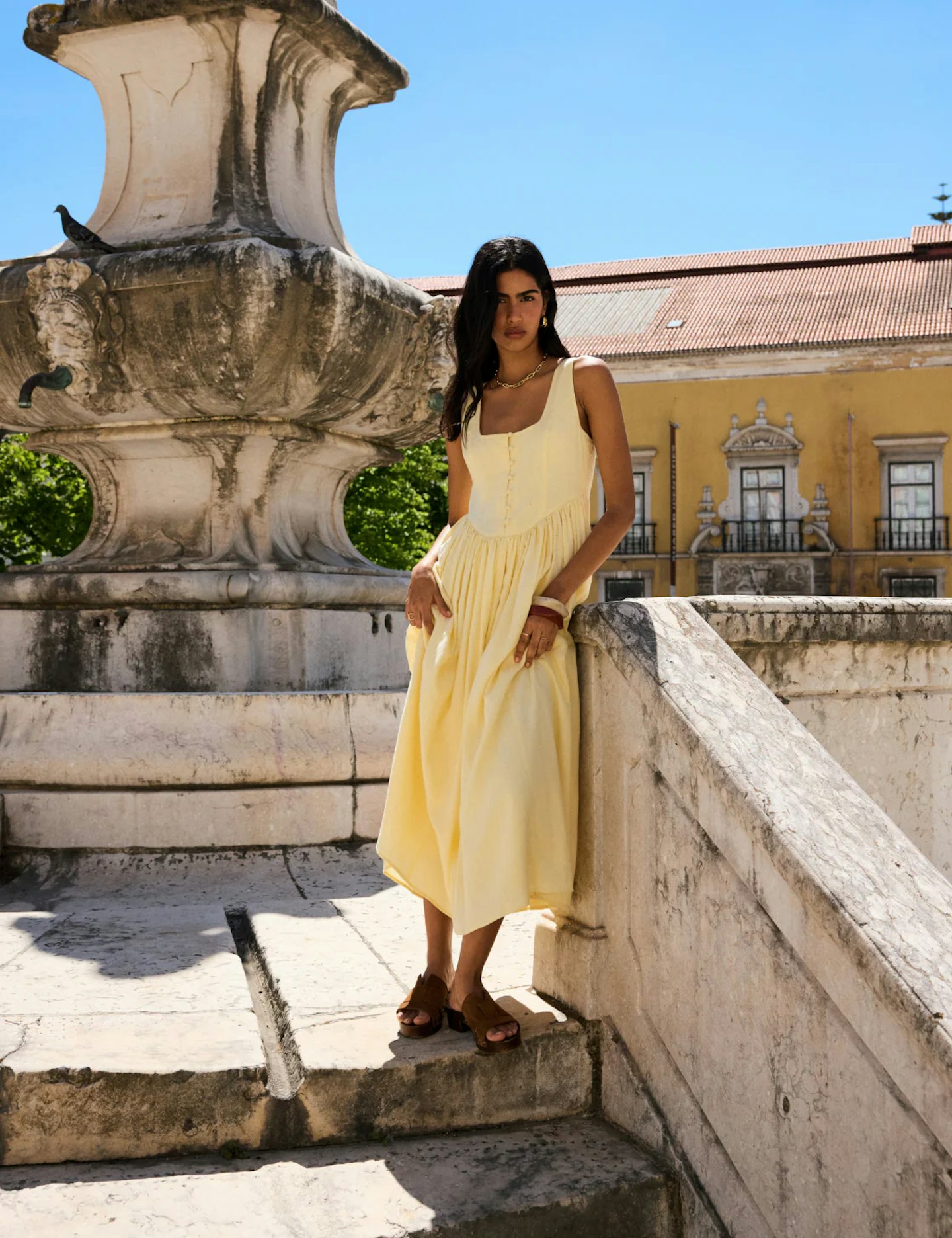Model wearing Nobody's Child Cora midi dress in butter yellow