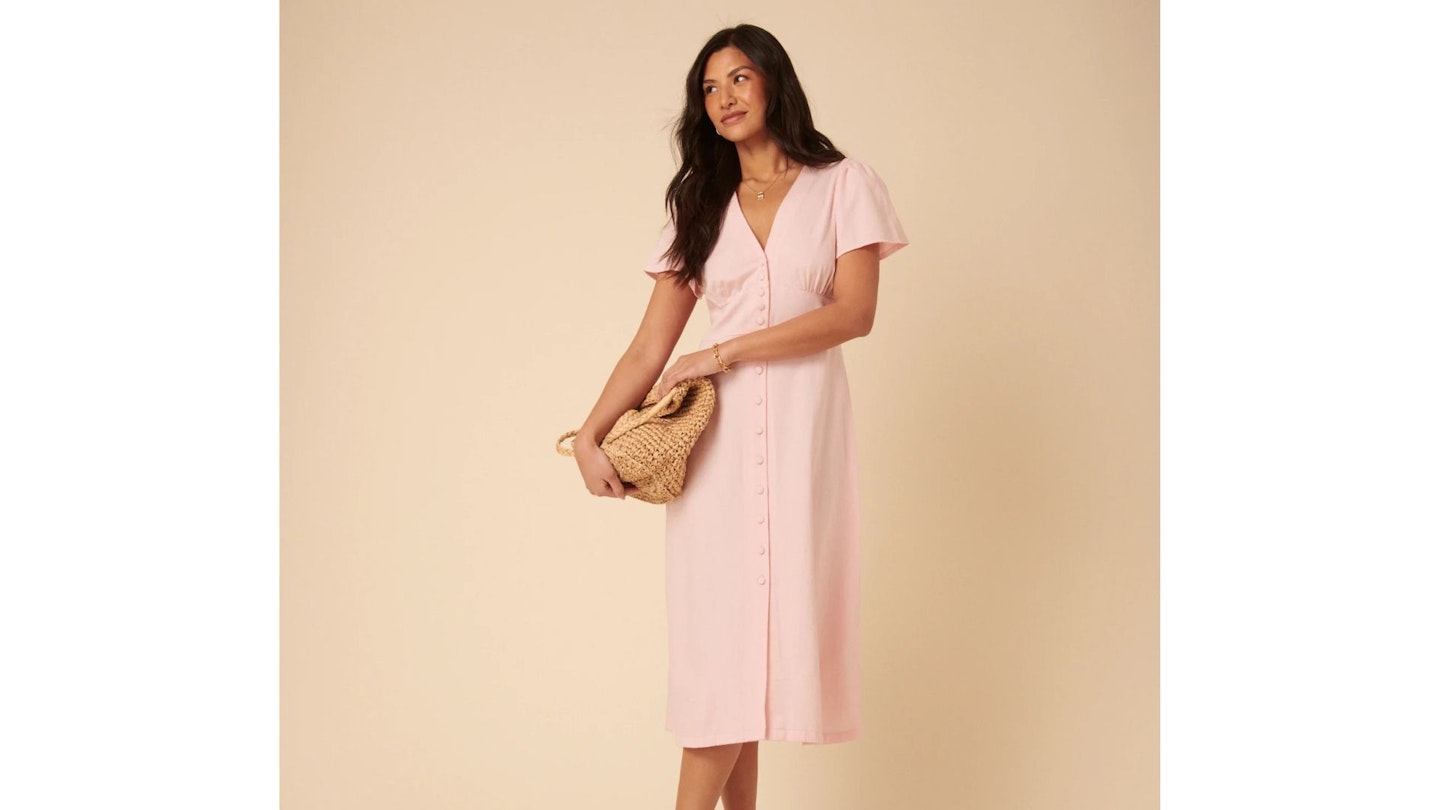 This gorgeous pink midi dress is loved by celebs and it's currently on sale This gorgeous pink midi dress is loved by celebs and it's currently on sale