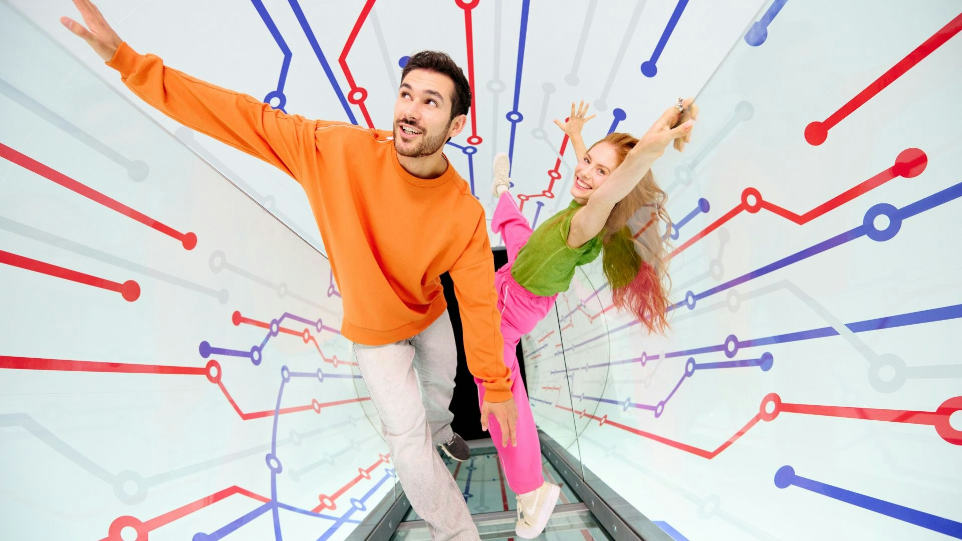 two people standing in a london underground themed tunnel