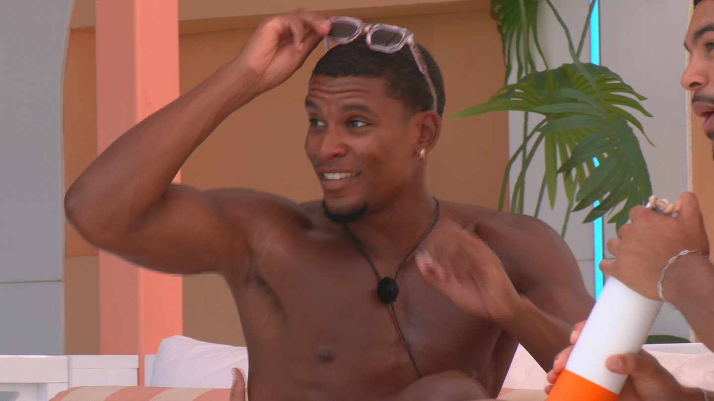 love island cach smiling