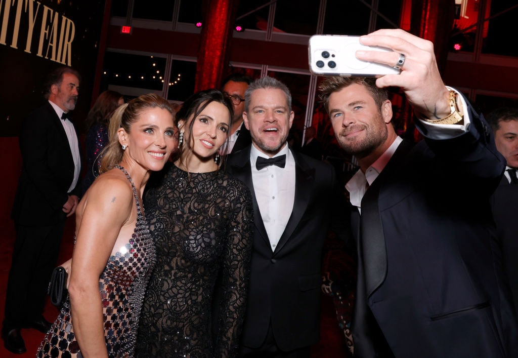 Elsa Pataky, Luciana Damon, Matt Damon, and Chris Hemsworth attend the 2024 Vanity Fair Oscar Party Hosted By Radhika Jones at Wallis Annenberg Center for the Performing Arts