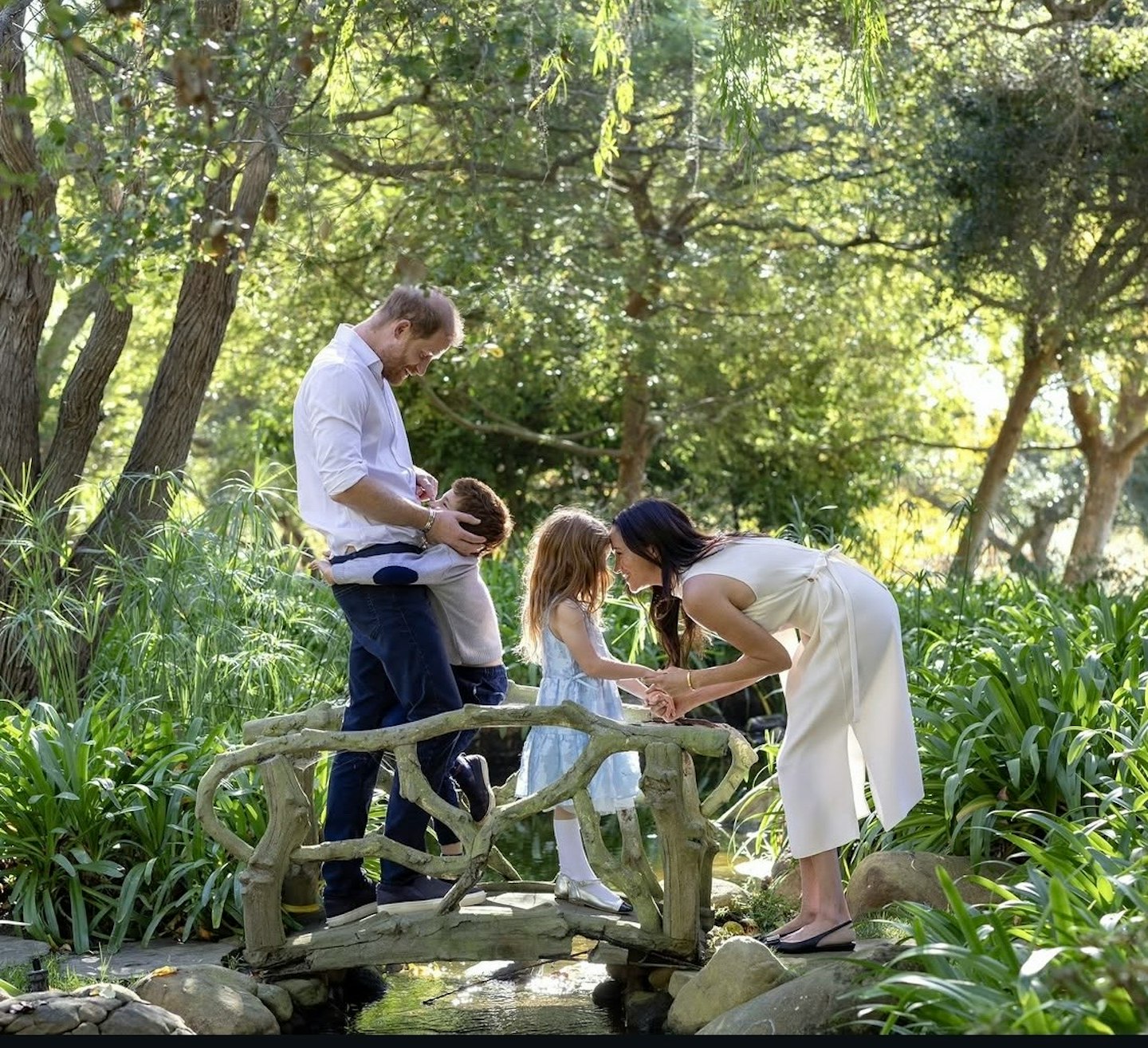 Prince Harry and Meghan Markle with their children