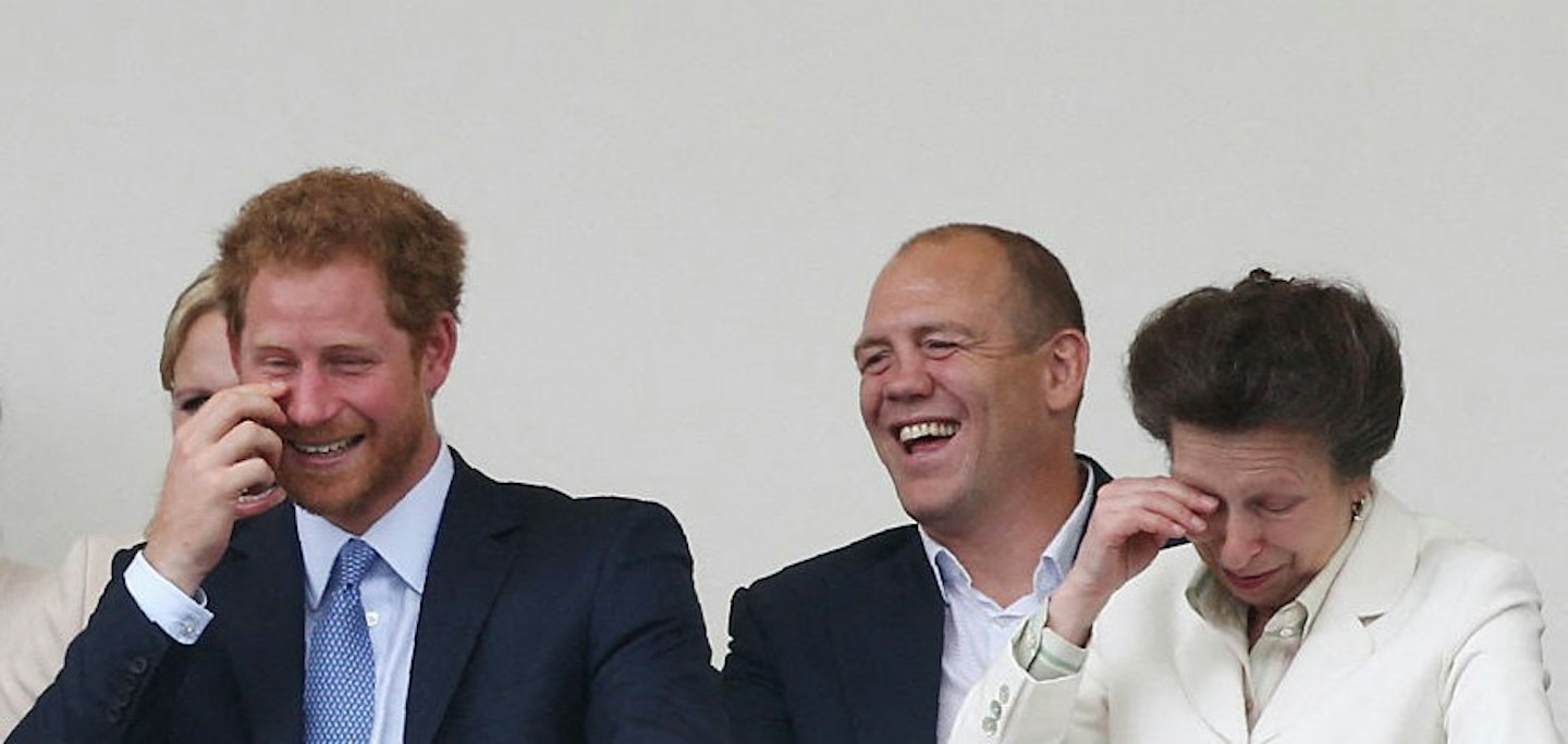 Princess Anne laugh as they attend the Patron's Lunch, a special street party outside Buckingham Palace in London as part of the three day celebrations for Queen Elizabeth II's official 90th birthday, with her husband Prince Philip, Prince William and Prince Harry.