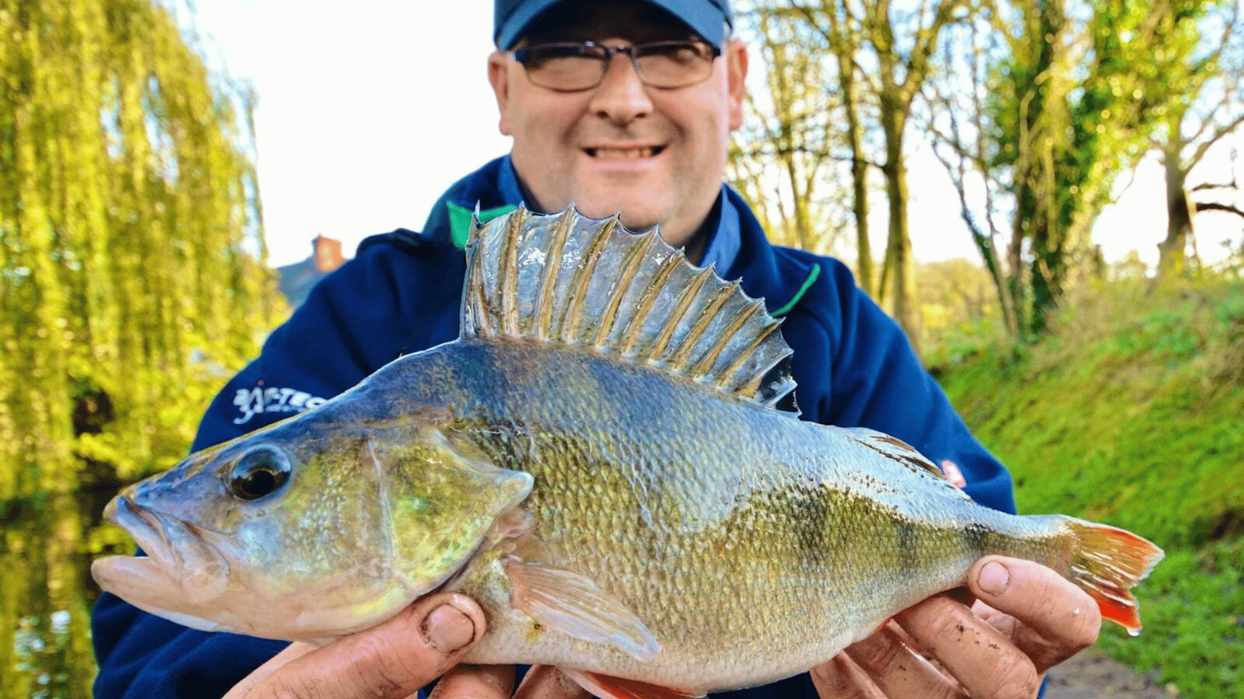 Darren holds a perch