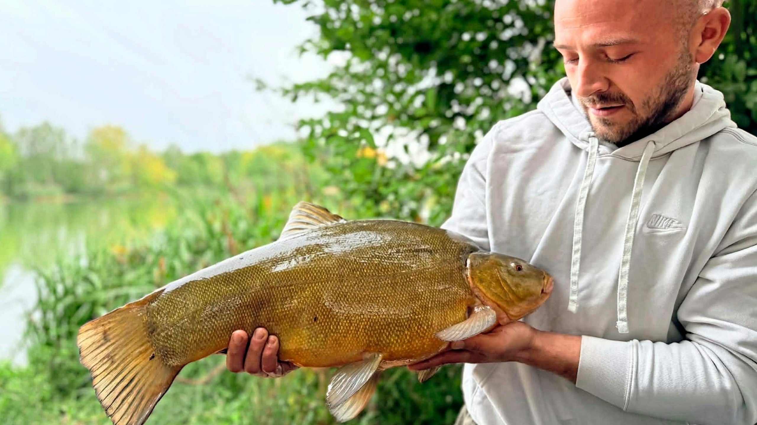 Louis Green holds up his catch of a 12lb 14ox trench