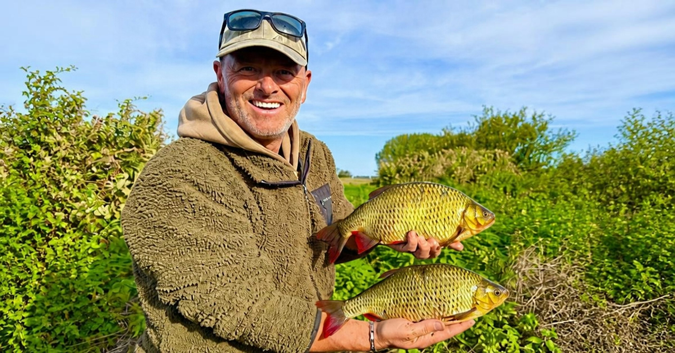 Mark Fox holding two rudd