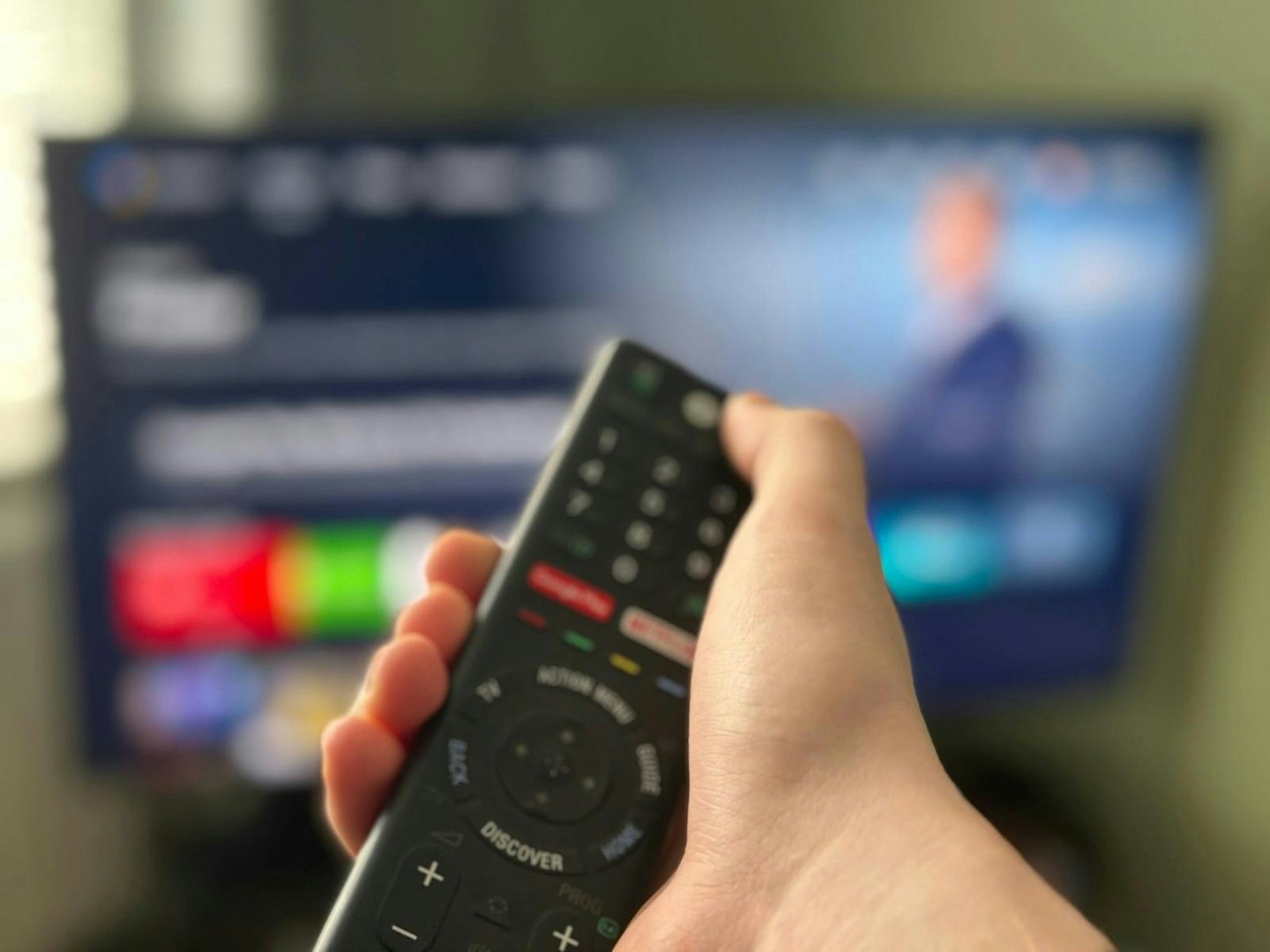 TV remote being pointed at TV. For the best 40-inch TV consider the remote control and smart features.