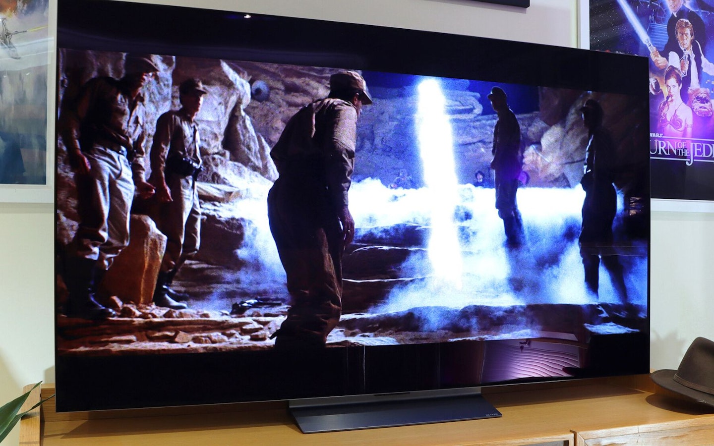 LG C5 OLED evo AI 65-inch TV in a lounge showing Indiana Jones and Raiders Of The Lost Ark