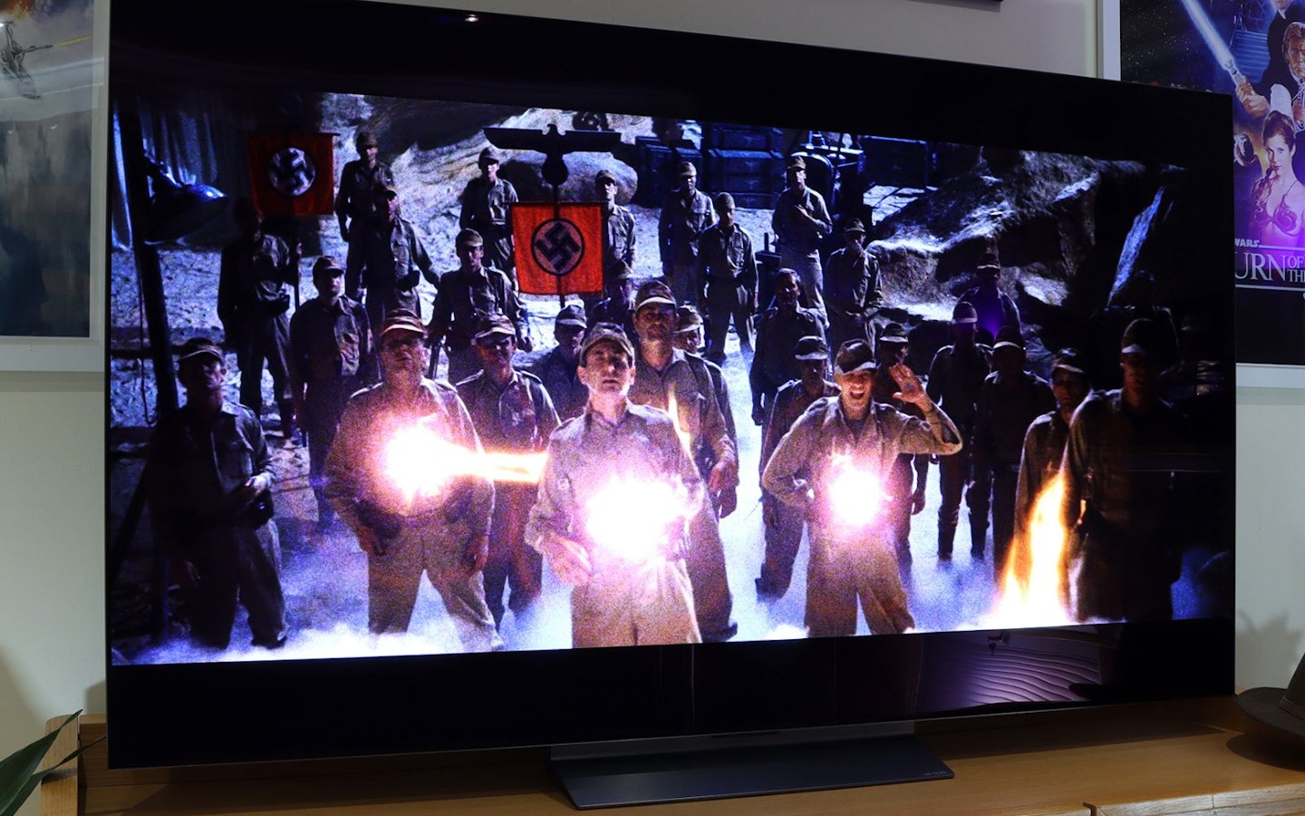 LG C5 OLED evo AI 65-inch TV in a lounge showing Indiana Jones and Raiders Of The Lost Ark