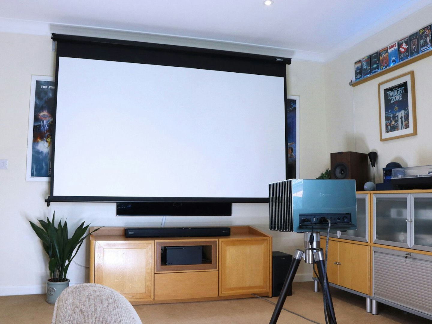 Valerion VisionMaster Pro 2 4K Laser Projector in a lounge with a 100-inch screen