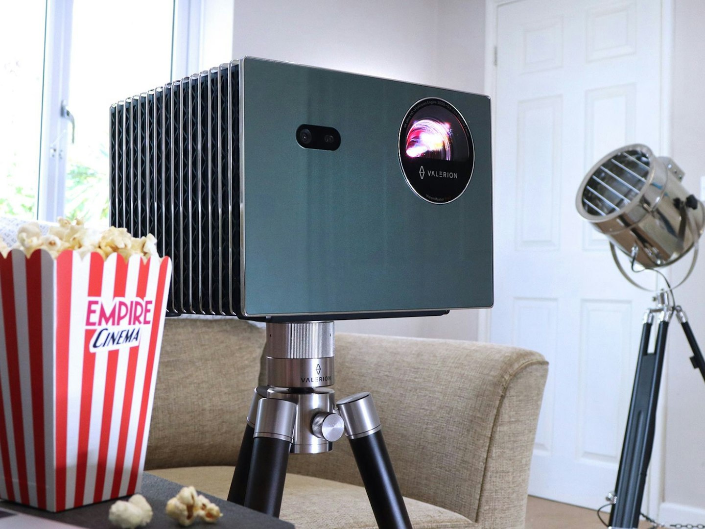 Valerion VisionMaster Pro 2 4K projector in a lounge with Empire popcorn