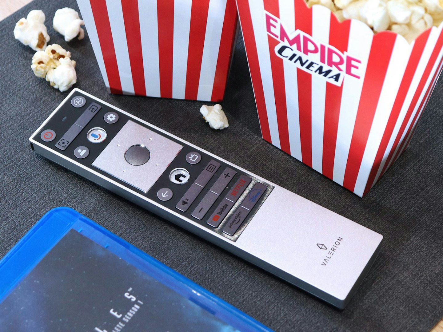 Valerion VisionMaster Pro 2 4K Laser Projector remote control with some popcorn