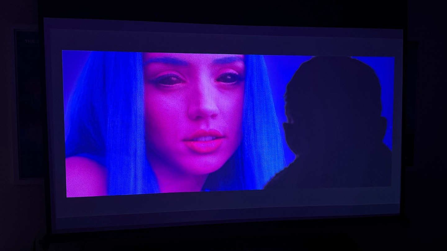 EPSON EF-22N projector displaying a scene from Blade Runner 2049 season two, with Ryan Gosling and Ana De Armas