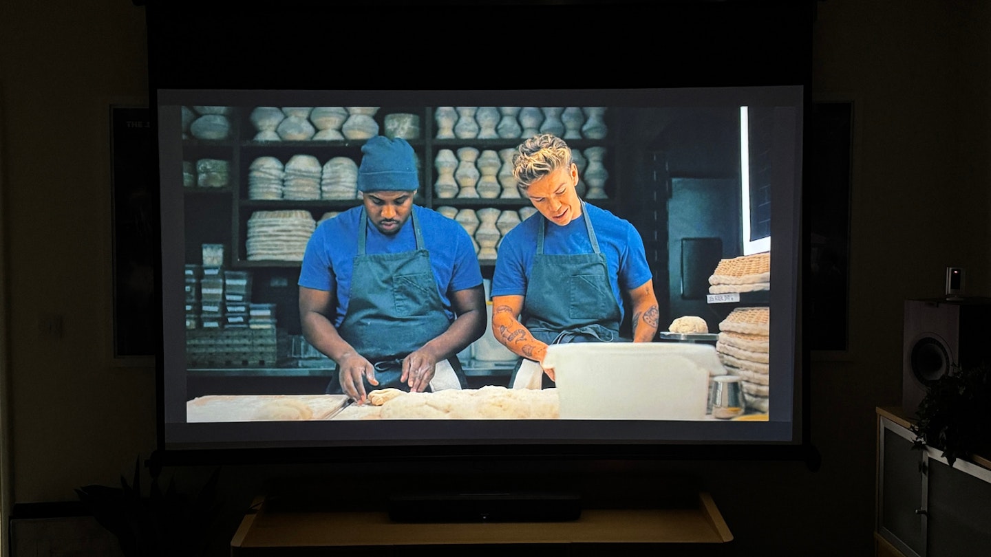 EPSON EF-22N projector displaying a scene from The Bear season two (Disney+), with L-Boy and Will Poulter mid-scene