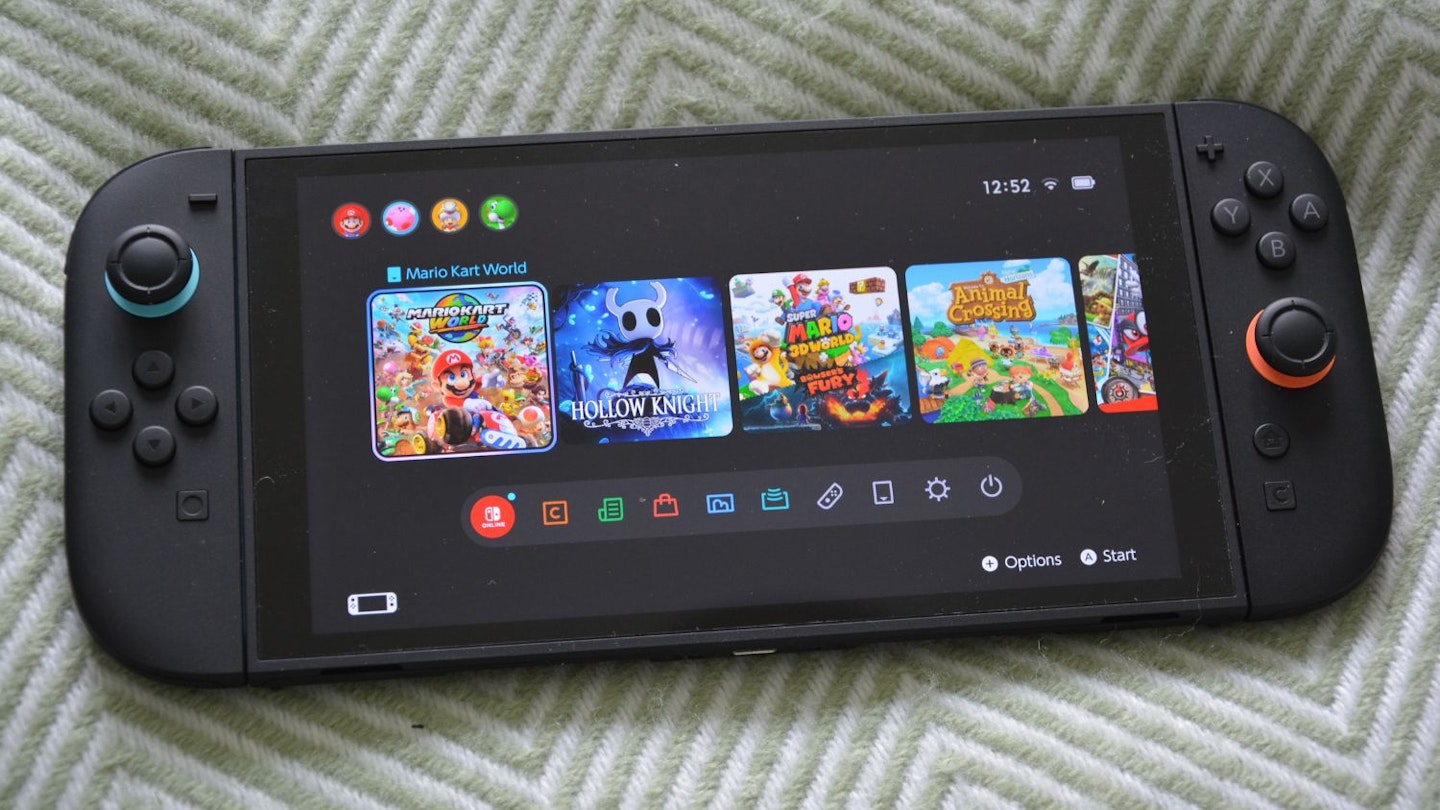 Nintendo Switch 2 home screen – game tiles for Mario Kart World, Hollow Knight, Mario 3D World + Bowser’s Fury, Animal Crossing, and Super Mario Odyssey