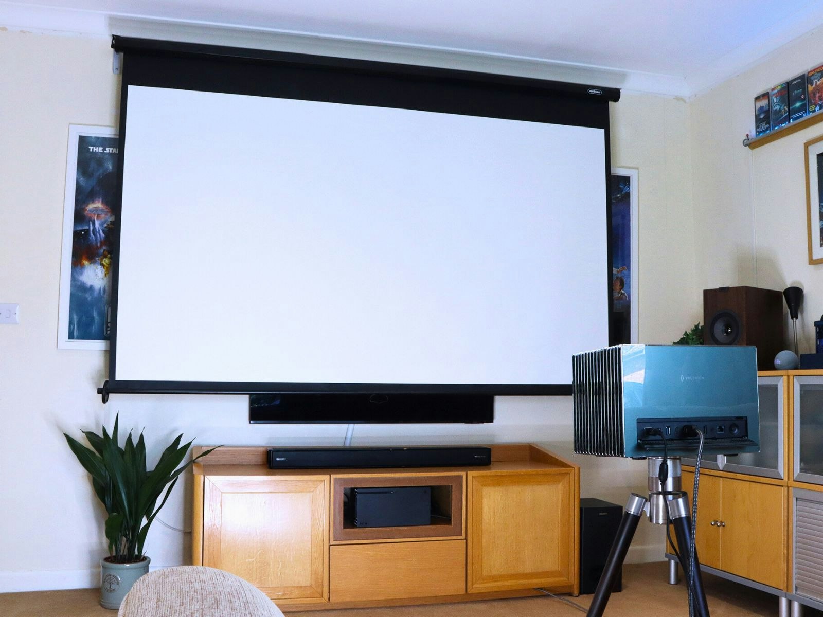 the VonHaus 100-inch projector screen in a living room with a projector