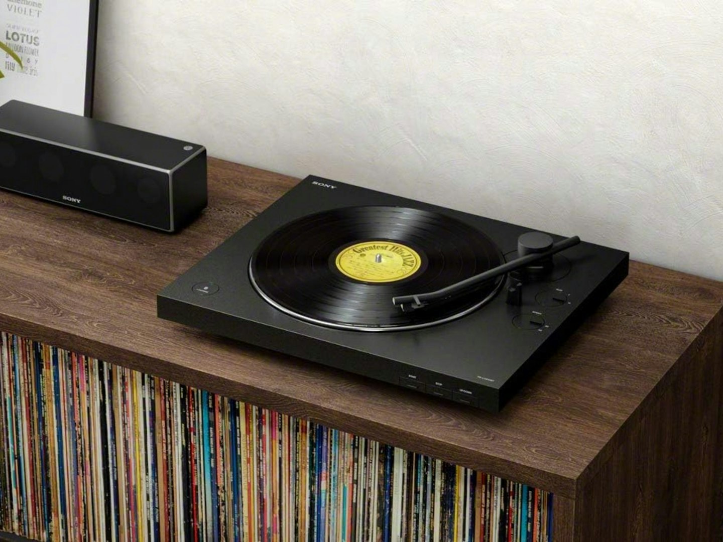 Sony PS-LX310BT Bluetooth Turntable pictured on sideboard with vinyl records. Tech gifts for men and women for Christmas.