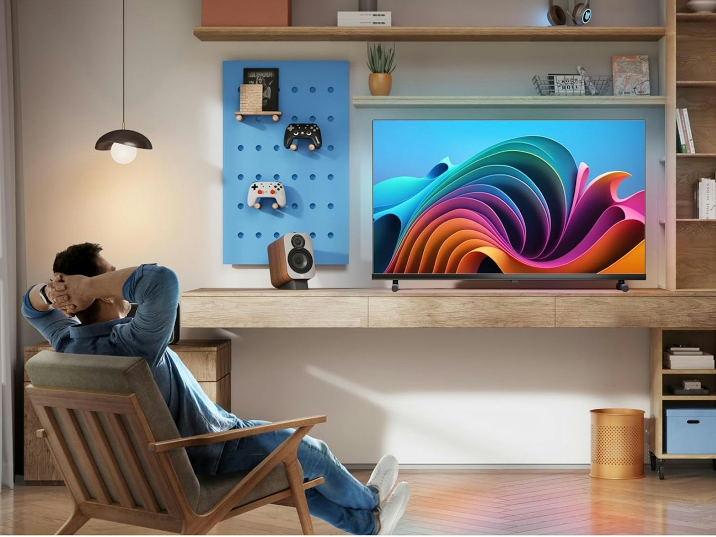 Hisense 32 inch Full HD QLED Smart TV 32A5NQTUK pictured in living room setup with person watching. Guide to the best tech Christmas gifts.