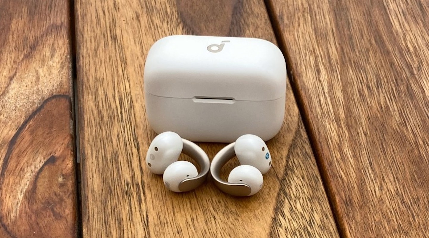 soundcore AeroClip open ear earbuds with charging case on table. Best tech gifts.