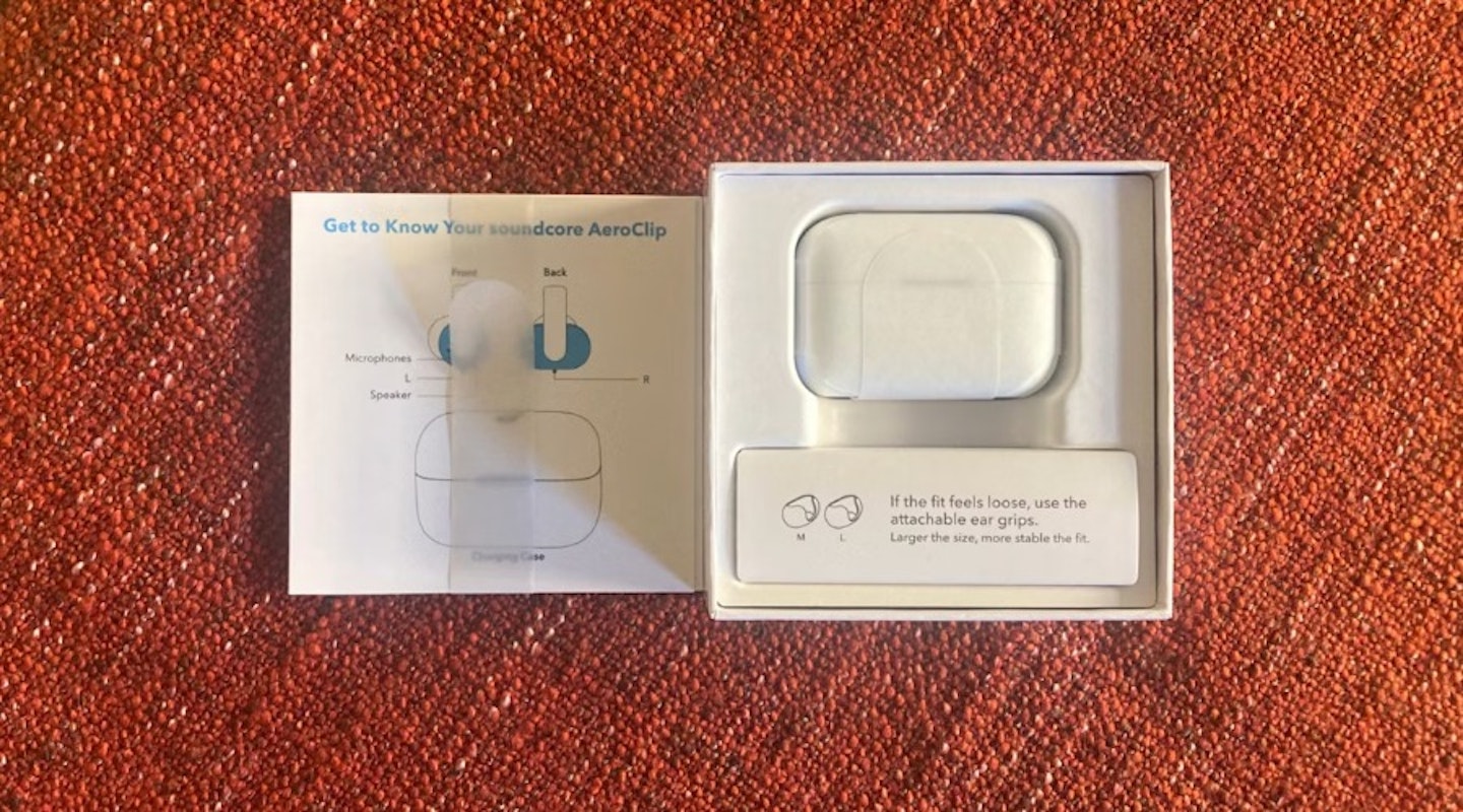 soundcore AeroClip open ear earbuds boxed with charging case and instructions. Best tech gifts.