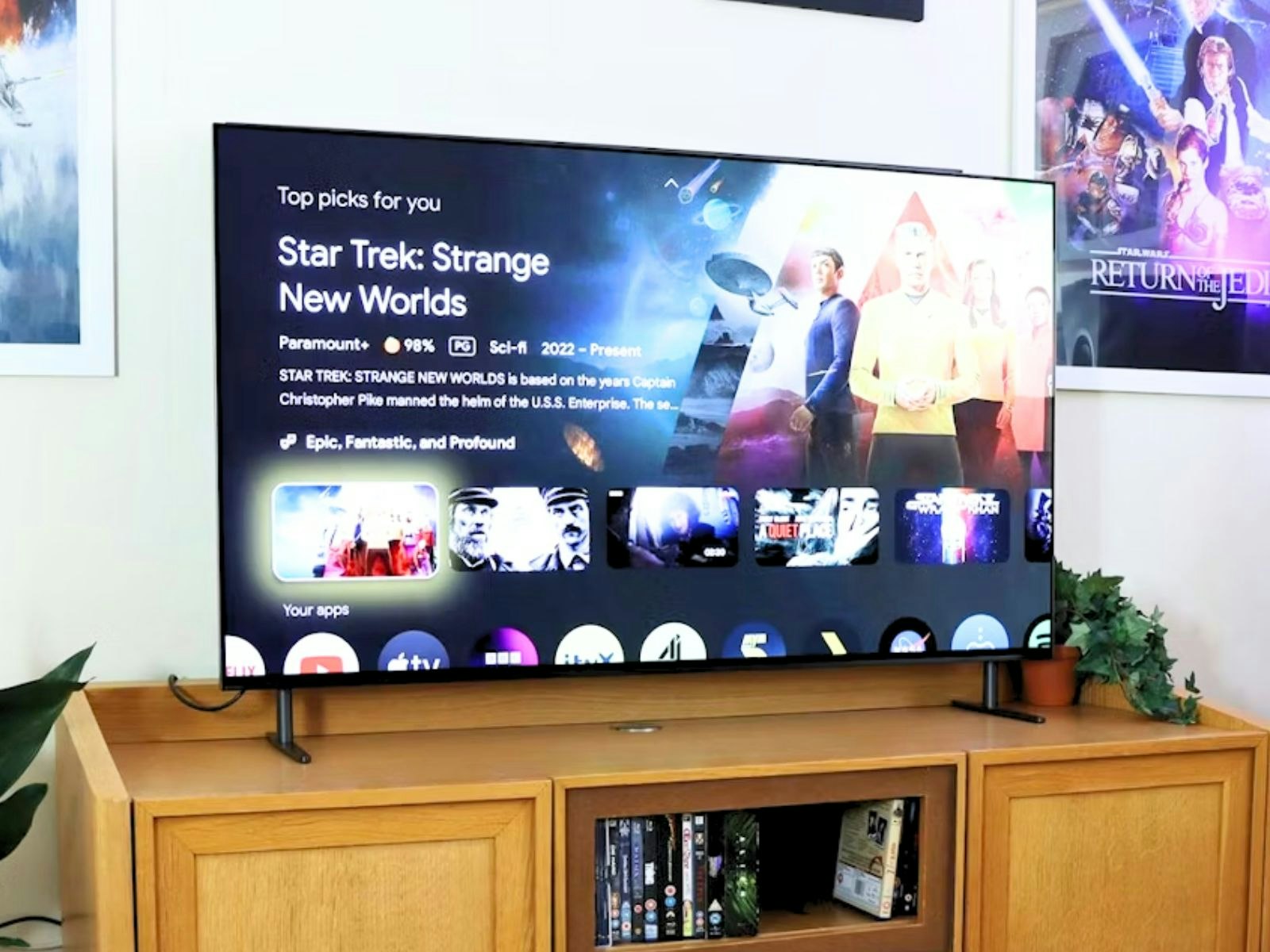 A Sony Bravia 8 TV in a loving room with movie posters