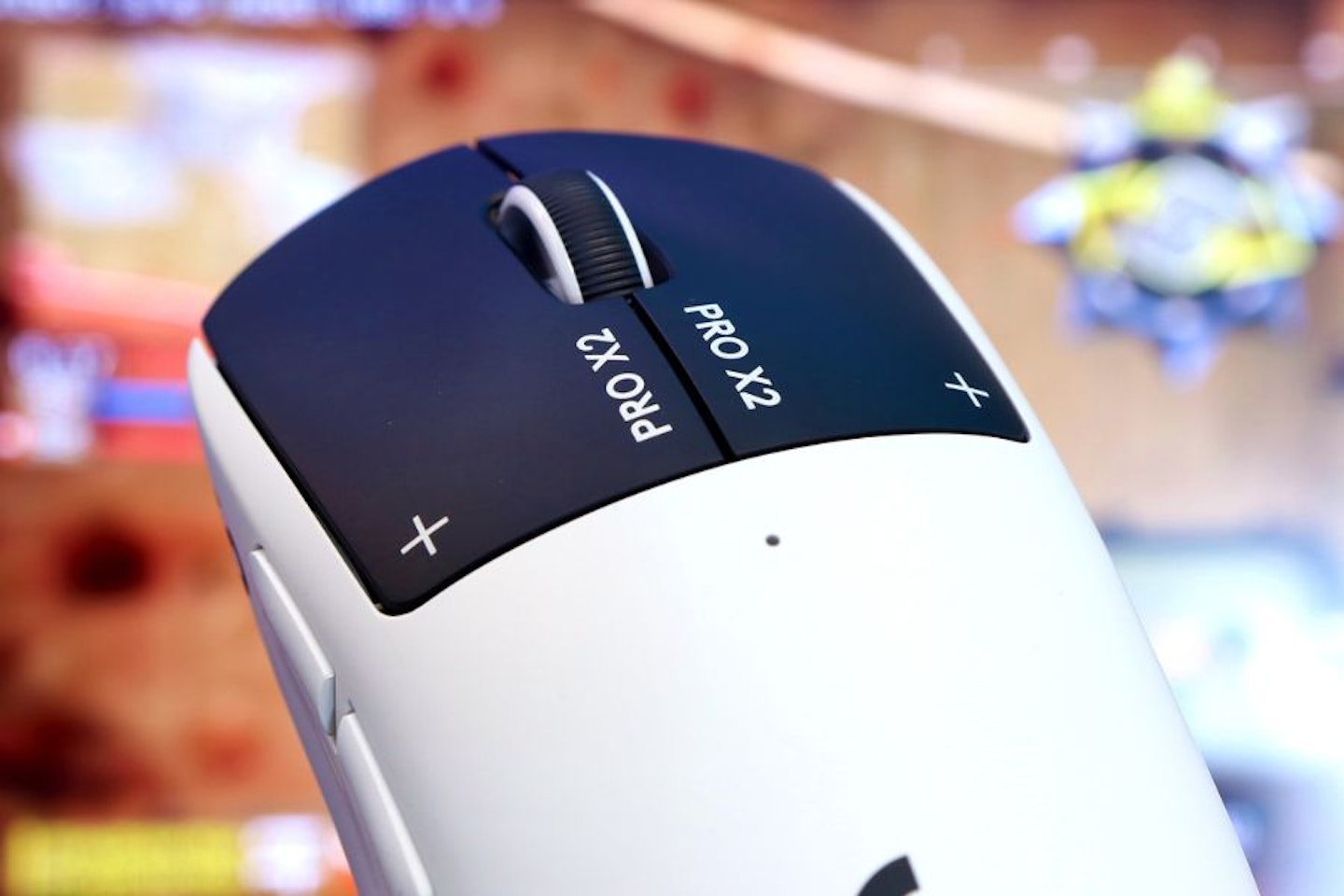 Logitech PRO X2 SUPERSTRIKE Gaming Mouse - top view of buttons, in front of game