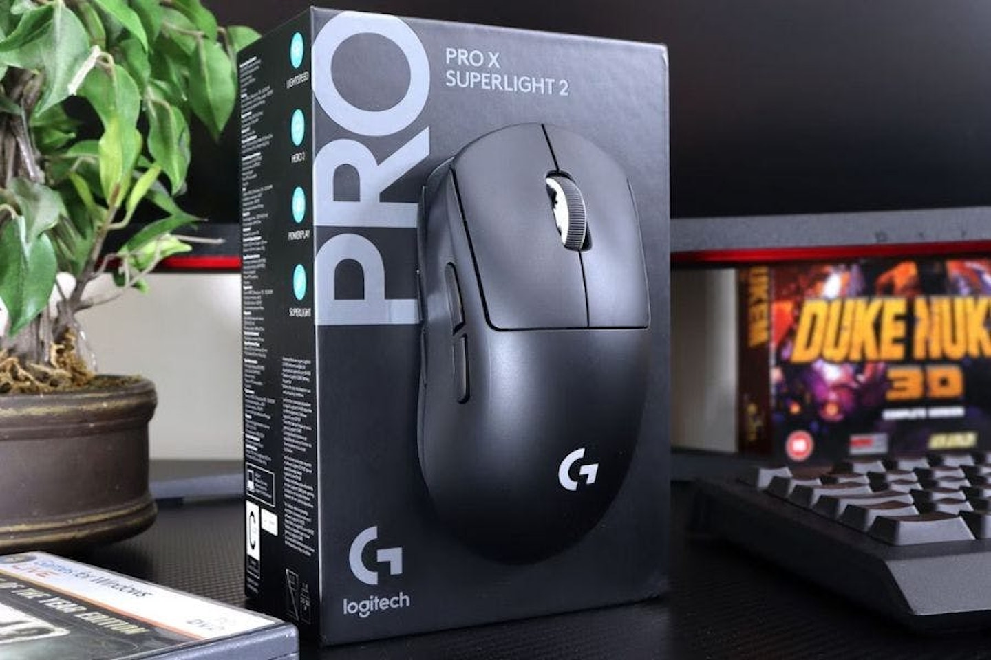 Logitech G PRO X Superlight 2 gaming mouse and box on a gaming desk