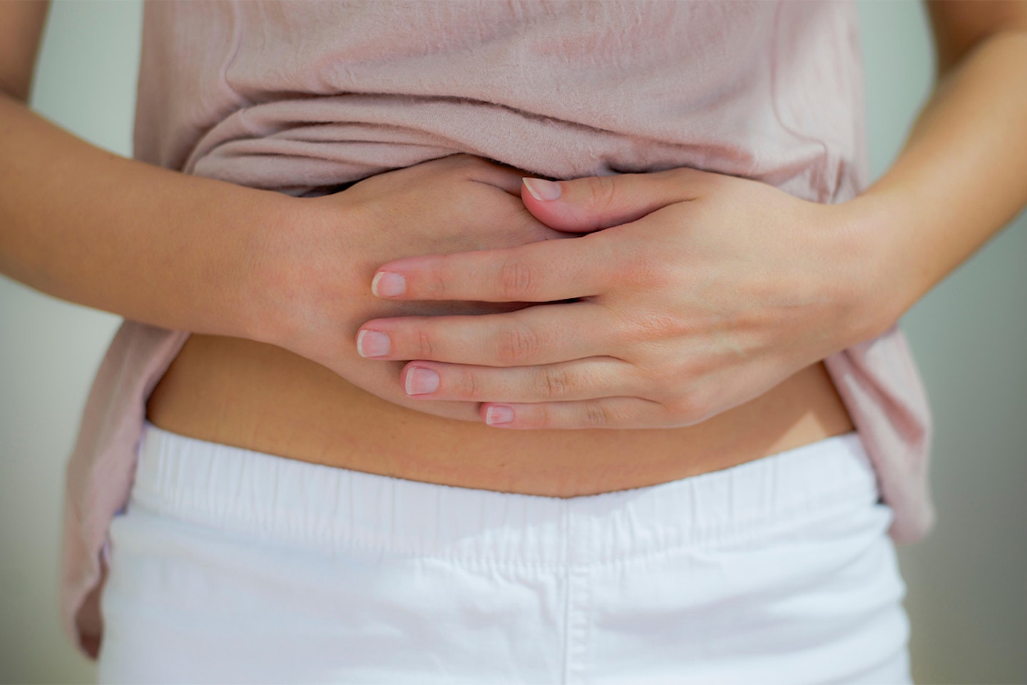 girl rubbing stomach