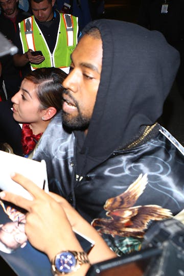 Kanye West breaks up paparazzi fight at airport | Celebrity | Heat