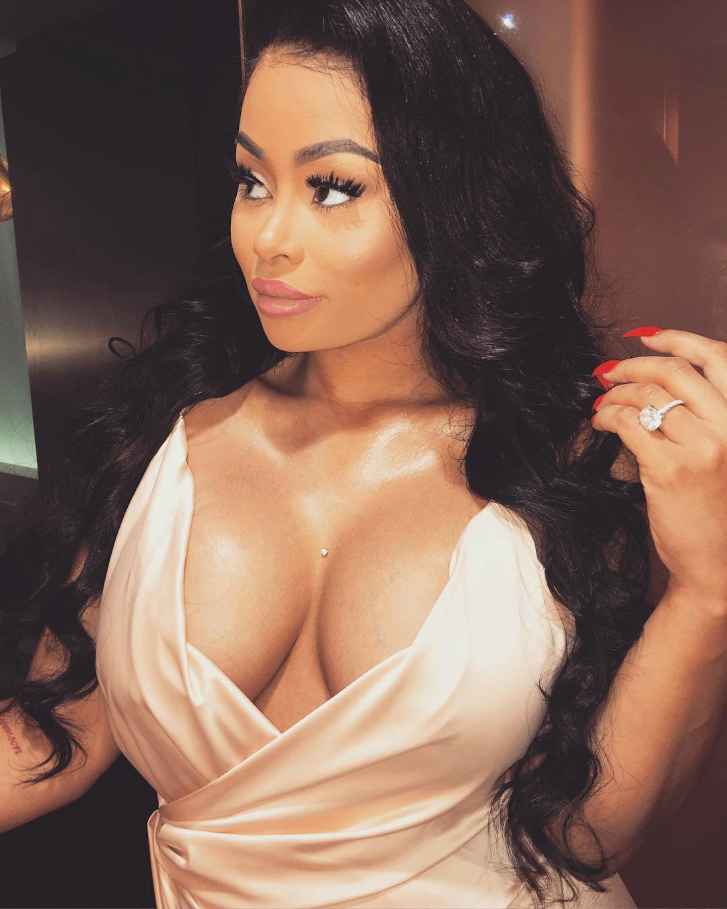 blac chyna pregnant wavy brunette hair white dress cleavage