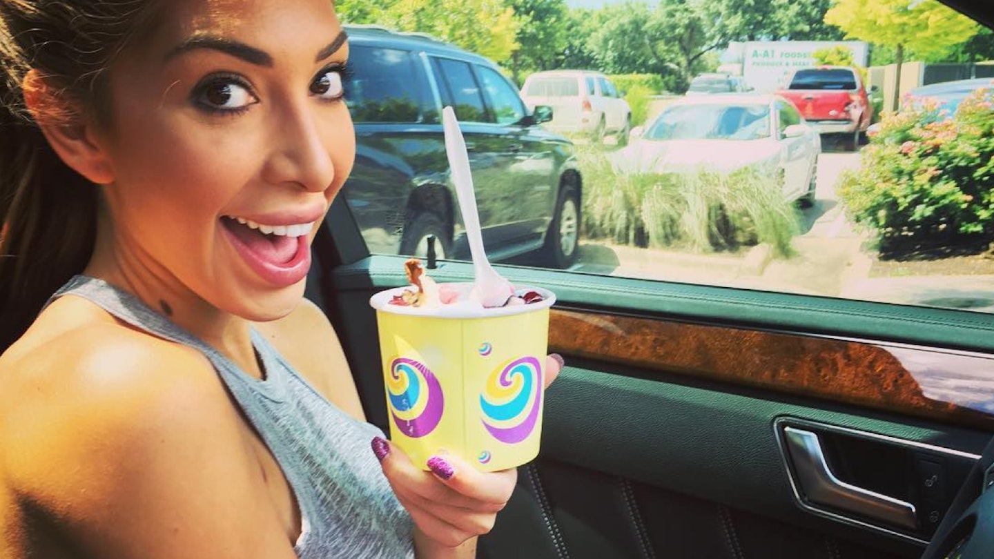 Farrah Abraham sipping a drink in her car
