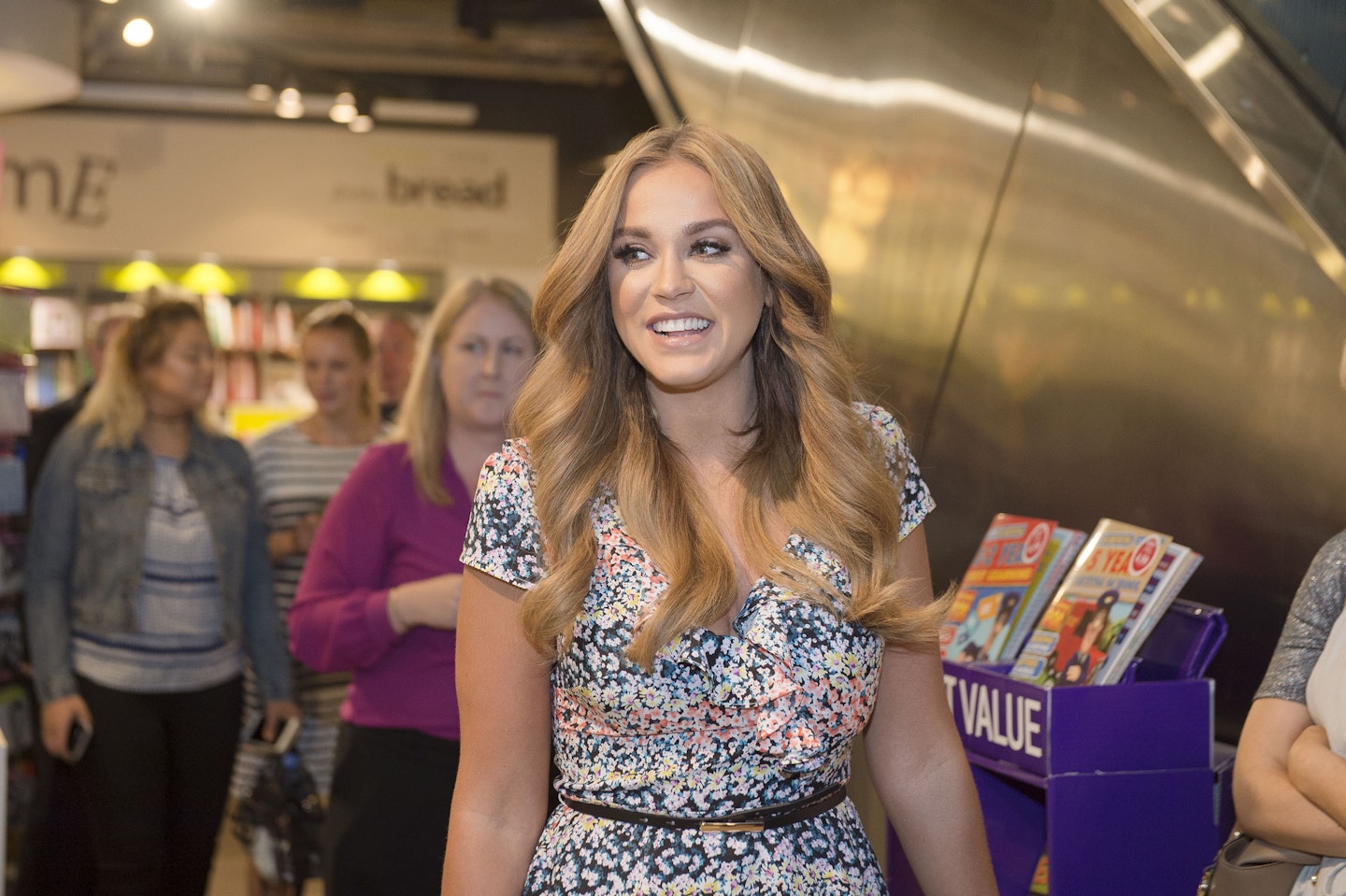 Vicky signs copies of her book for fans