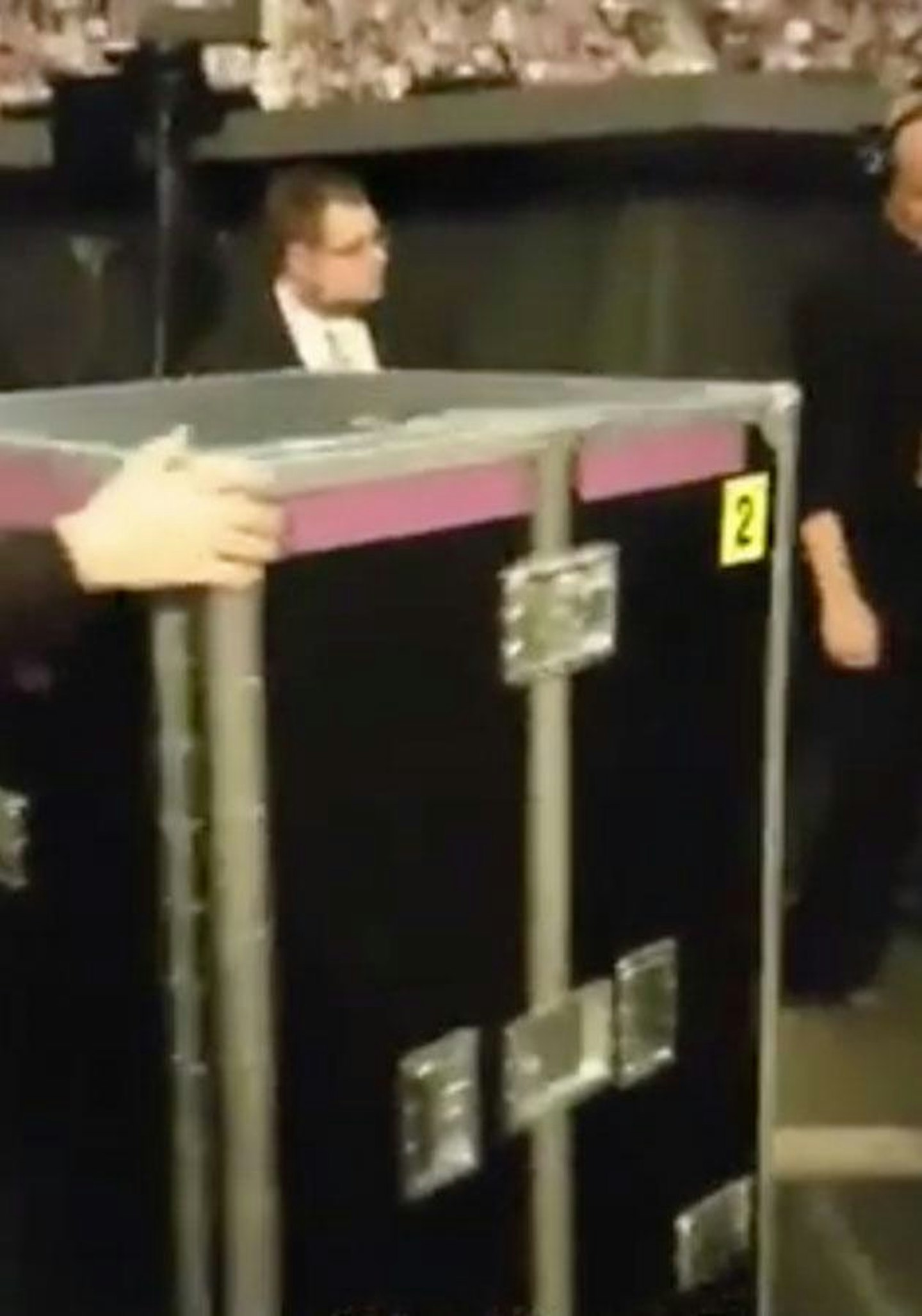 Adele is transported on stage in box