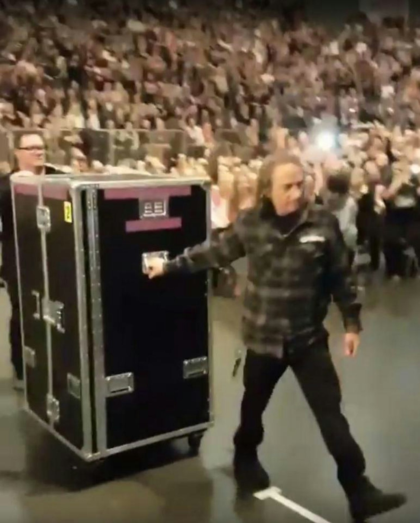 Adele is transported on stage in box