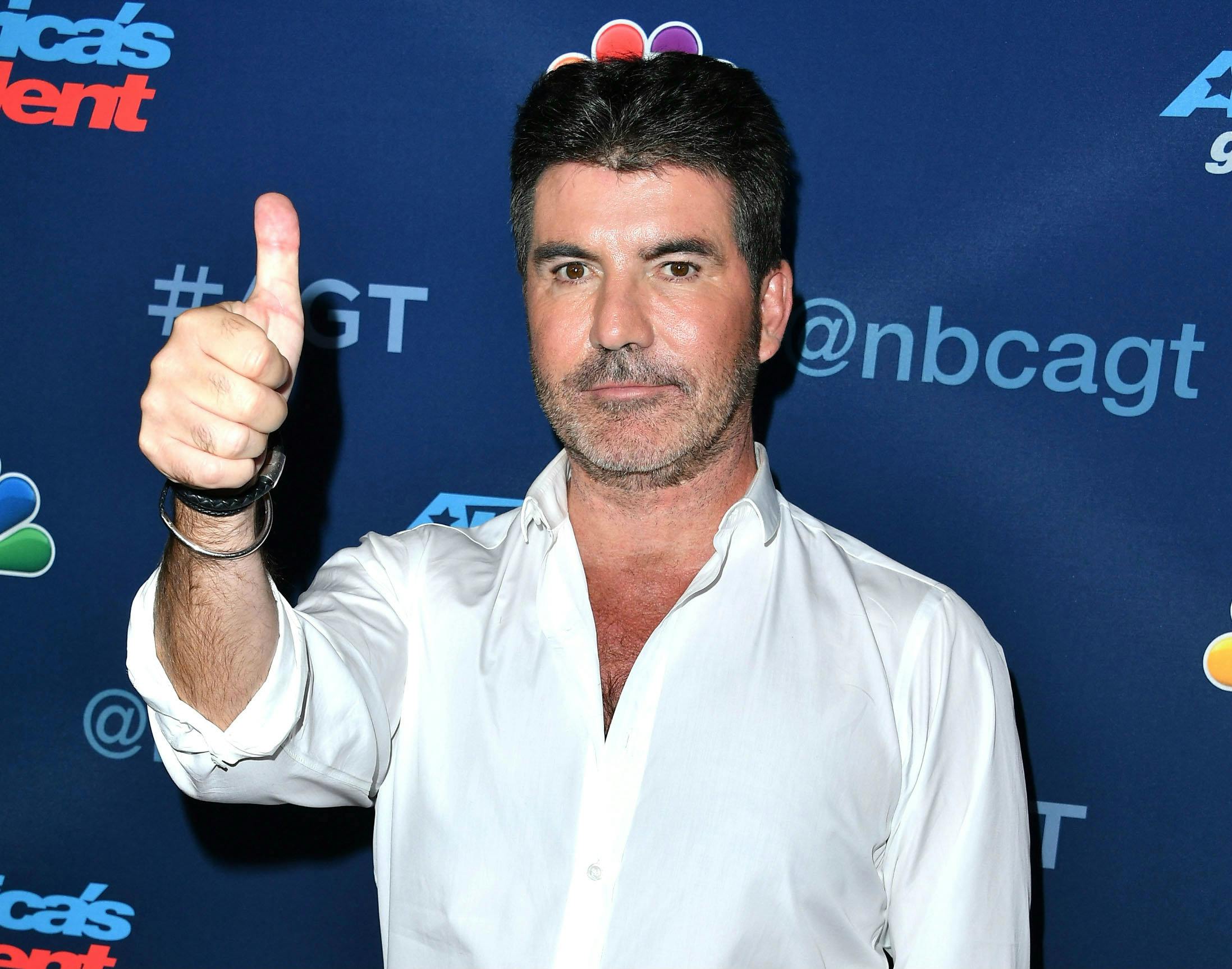 You HAVE to see this throwback American Idol pic of Simon Cowell - heat