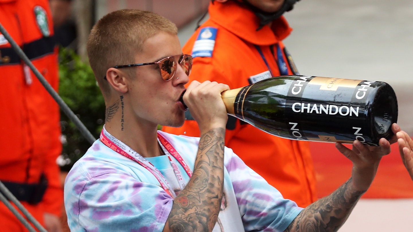 Justin Bieber drinking a massive bottle of Champers