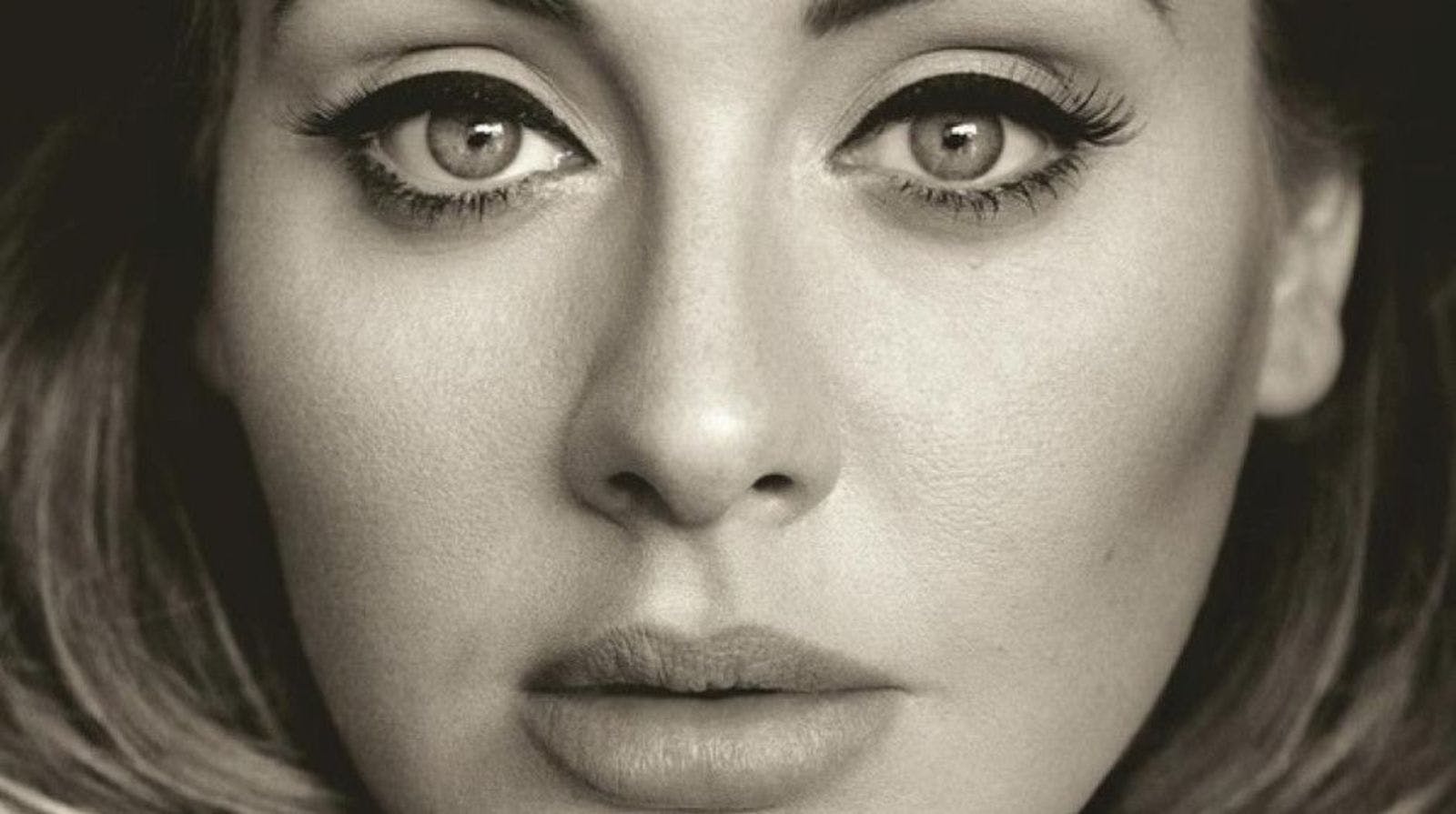 Adele poses topless with nothing but a phone cord to cover her up