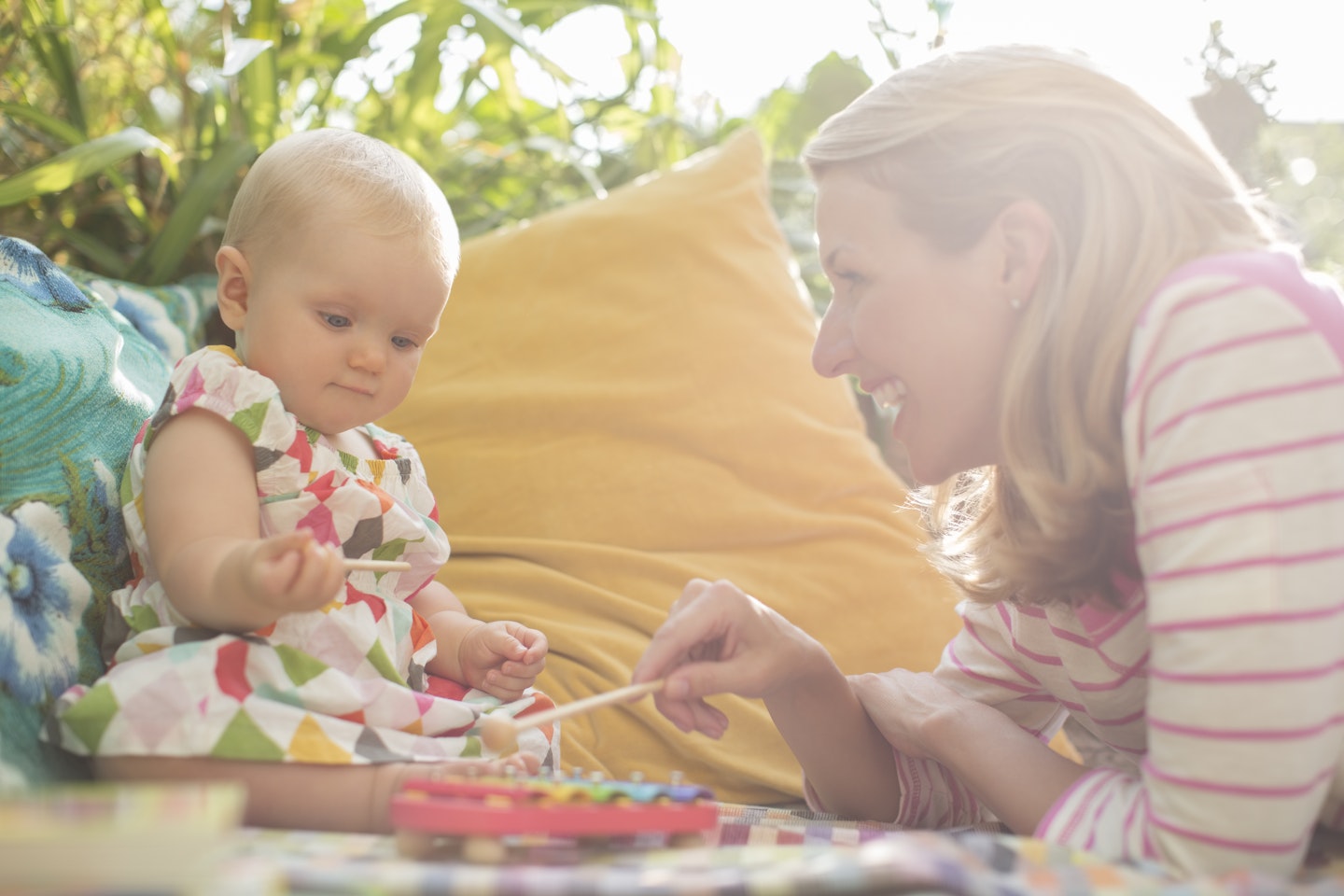 mum womans baby play outside music.