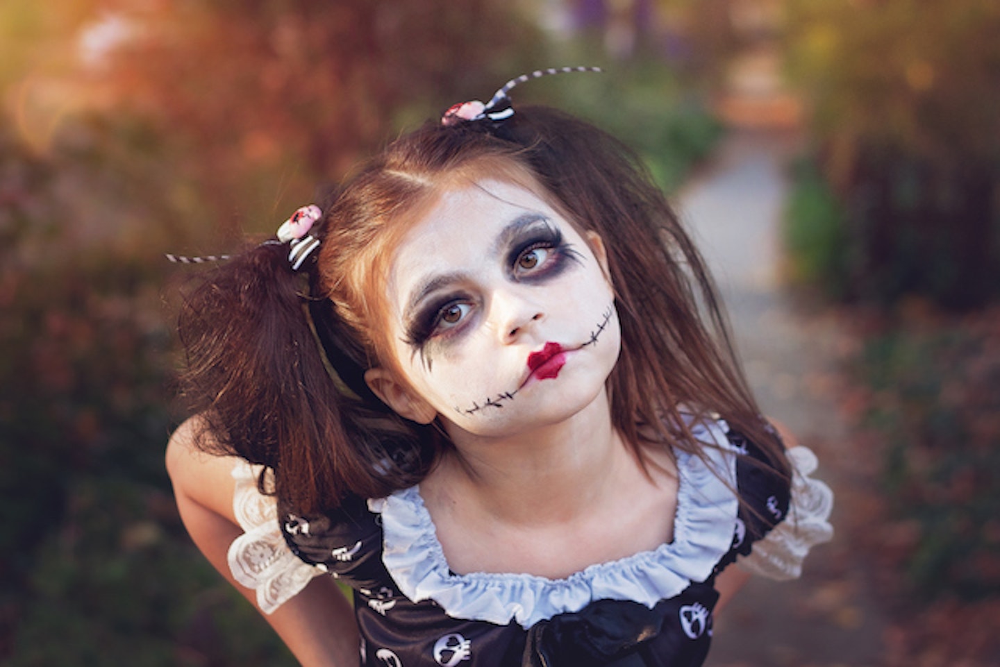 Girl with witch face paint 