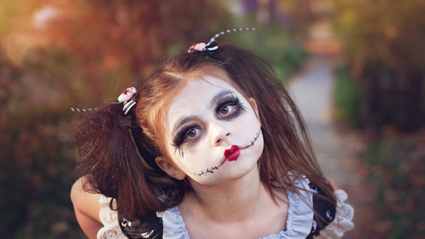 Girl with witch face paint 