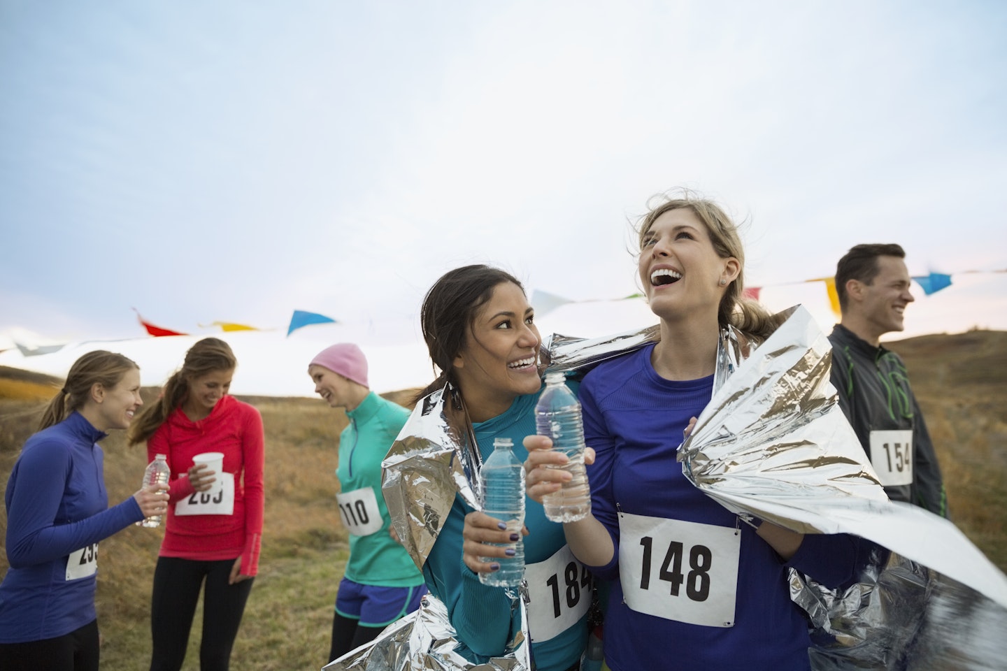 Women celebrate finishing a race