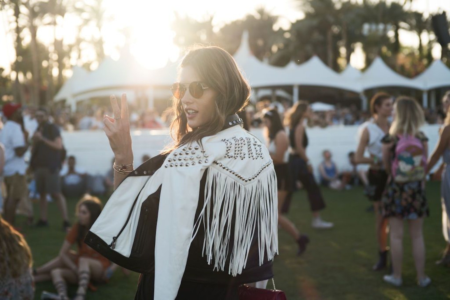 Alessandra Ambrosio wears round sunglasses at Coachella festival