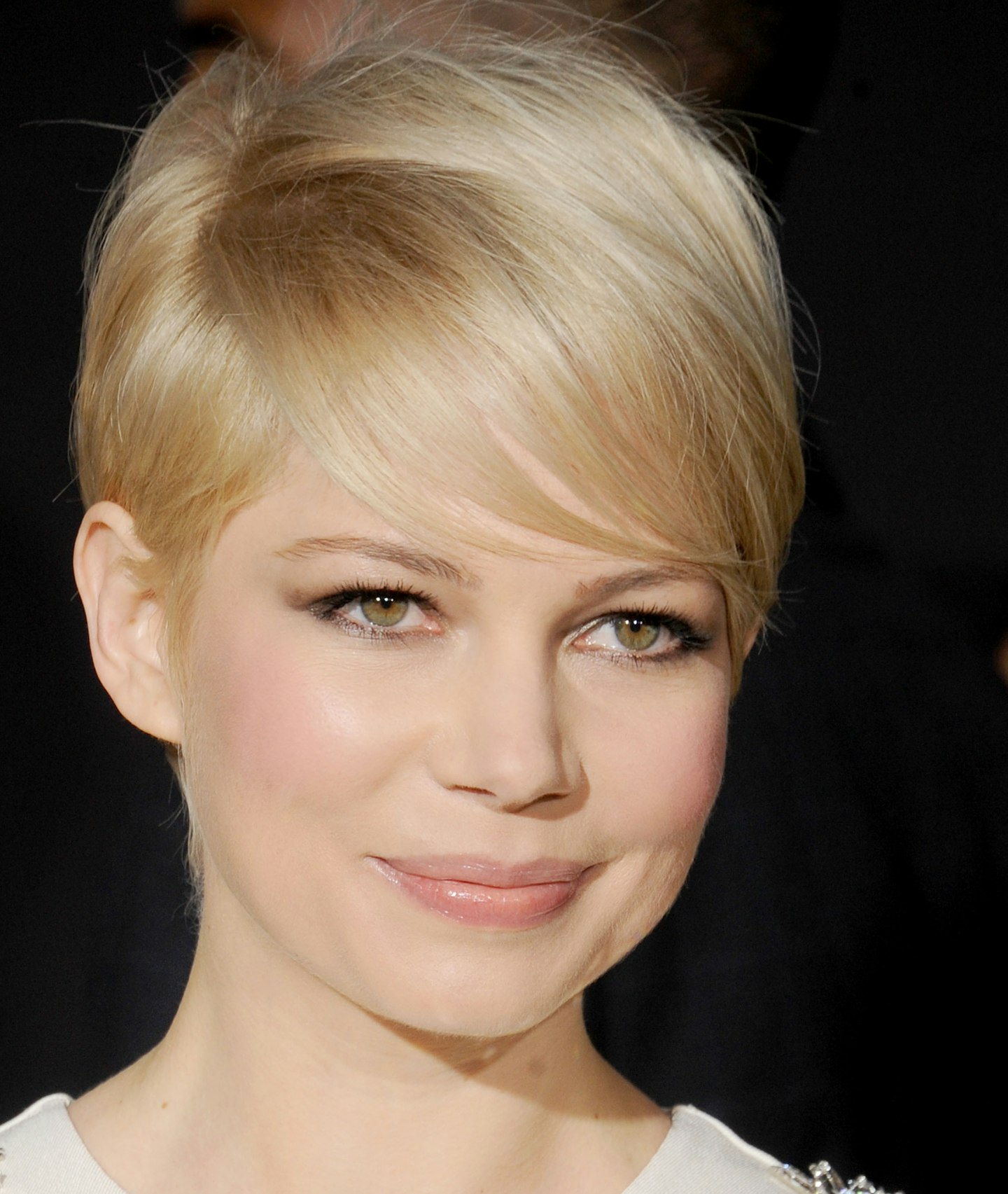 Lea Seydoux Light Red Pixie Haircut with Side Swept Bangs and Blonde  Highlights