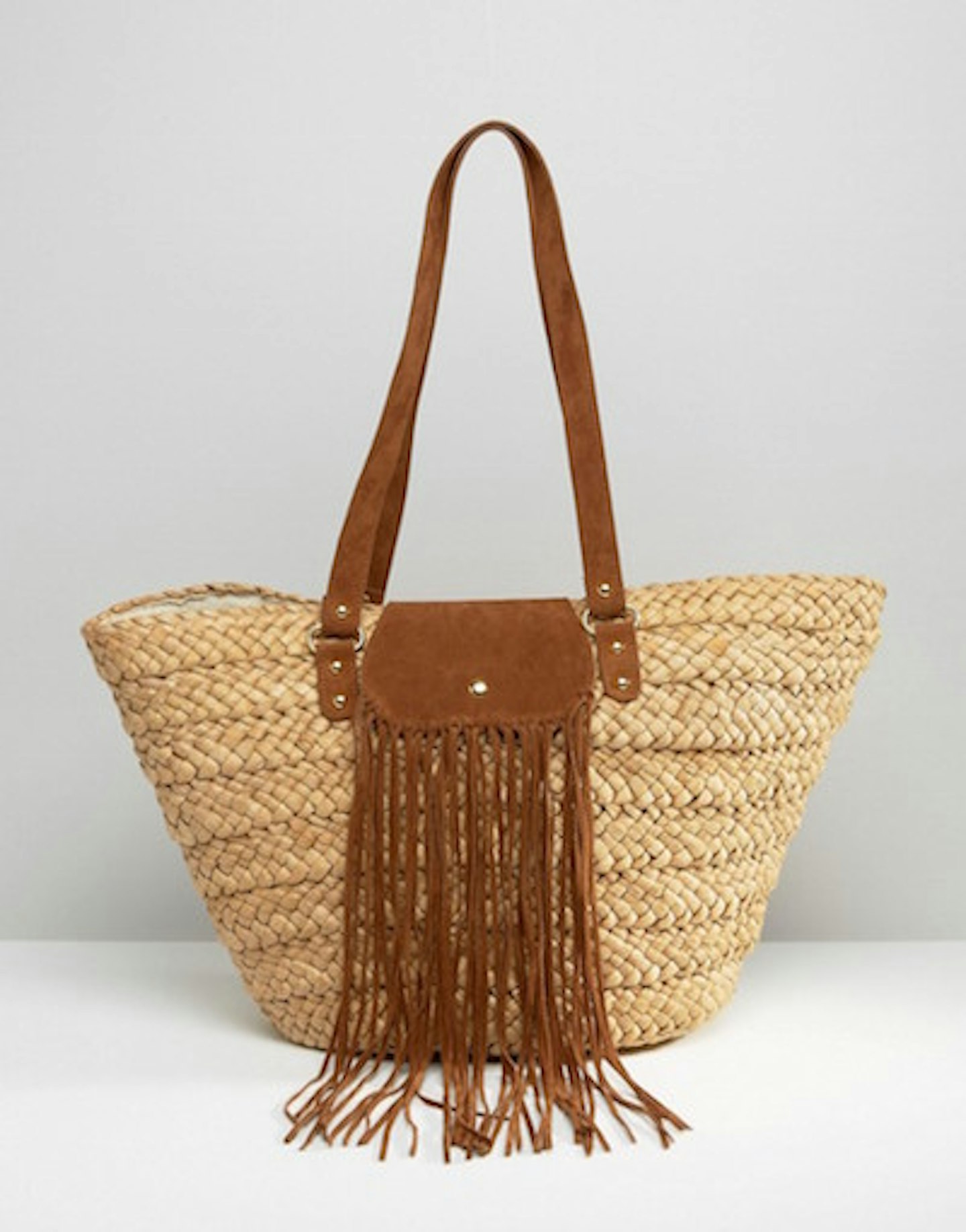 Woven fringed beach bag.